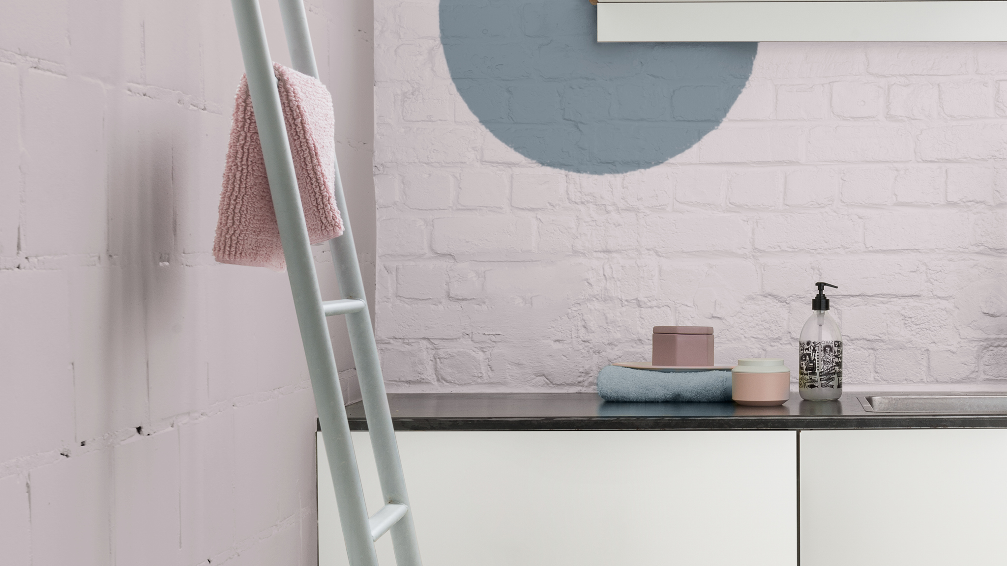 Two tone bathroom Unexpected geometric shapes painted in accent colours bring energy to a space.