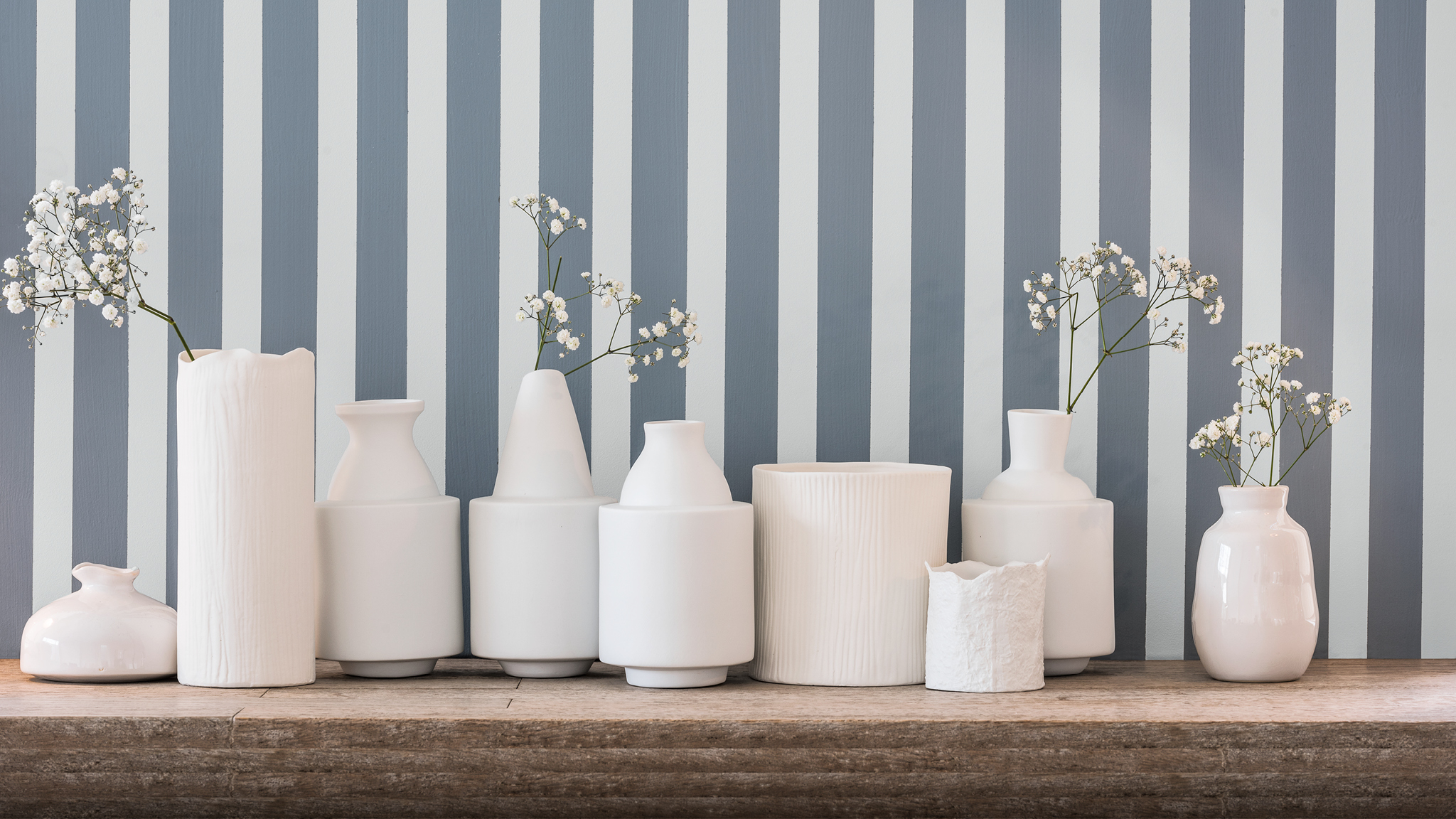 Two-tone striped wall and candles Create graphic patterns through two-tone walls.