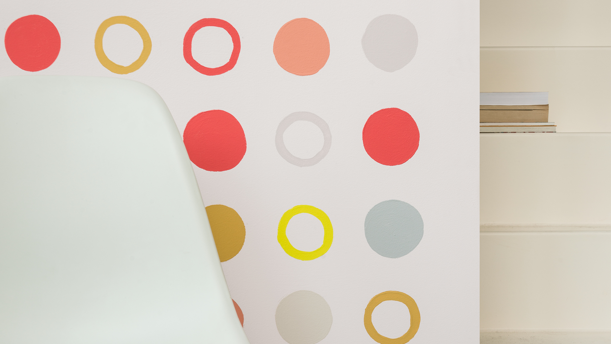 Spotted wall design Design a creative and energising breakout space by painting circles in different hues on your wall.