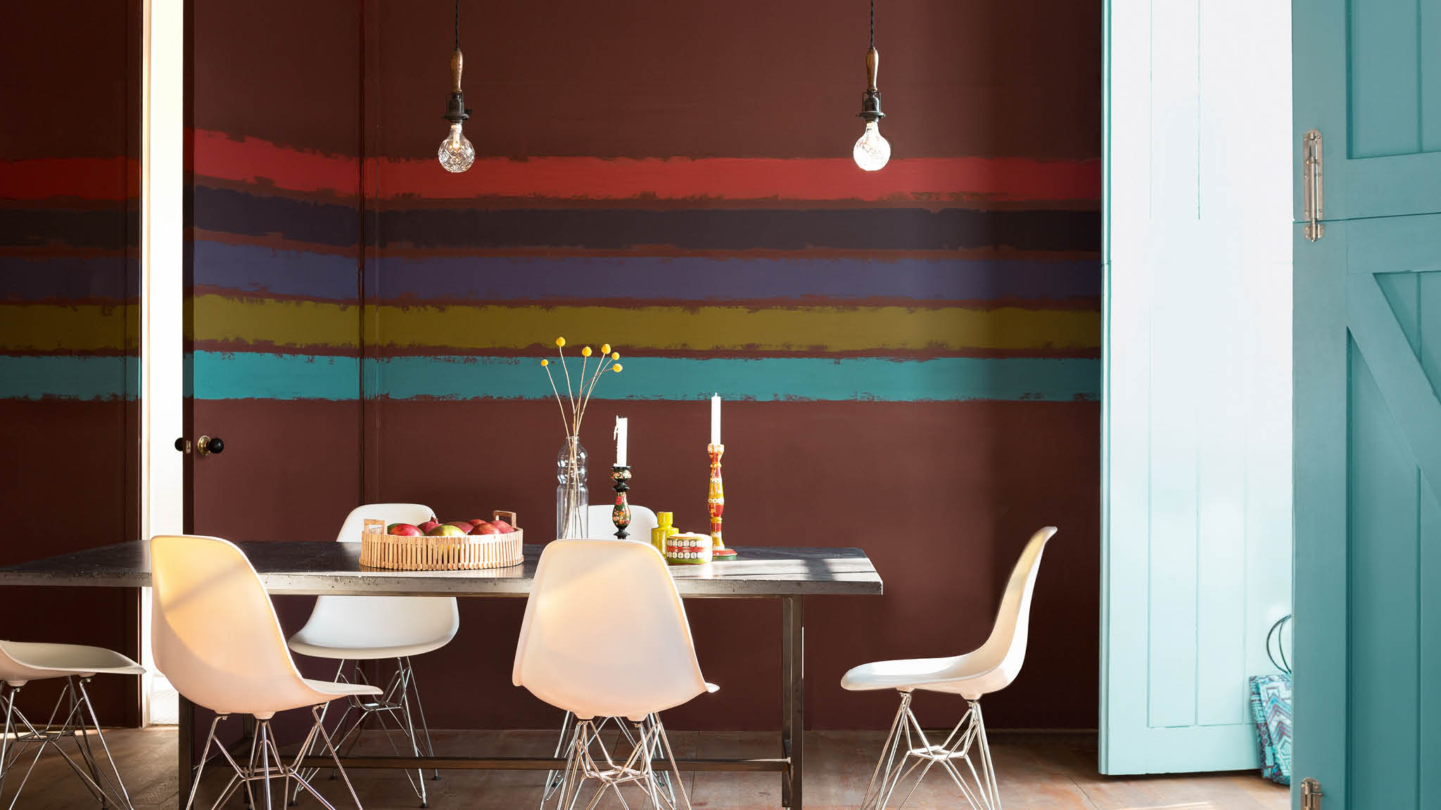 Dining room with striped paint effect If your dining area is part of a larger open-plan room, consider defining the space with a bold and colourful paint effect.