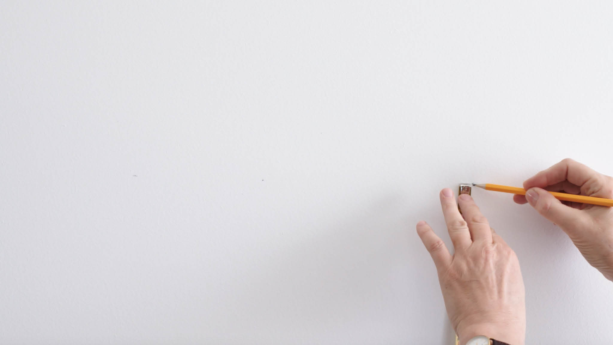 Measuring up a line to create a two-tone wall Mark the spot where you want your two-tone wall to meet