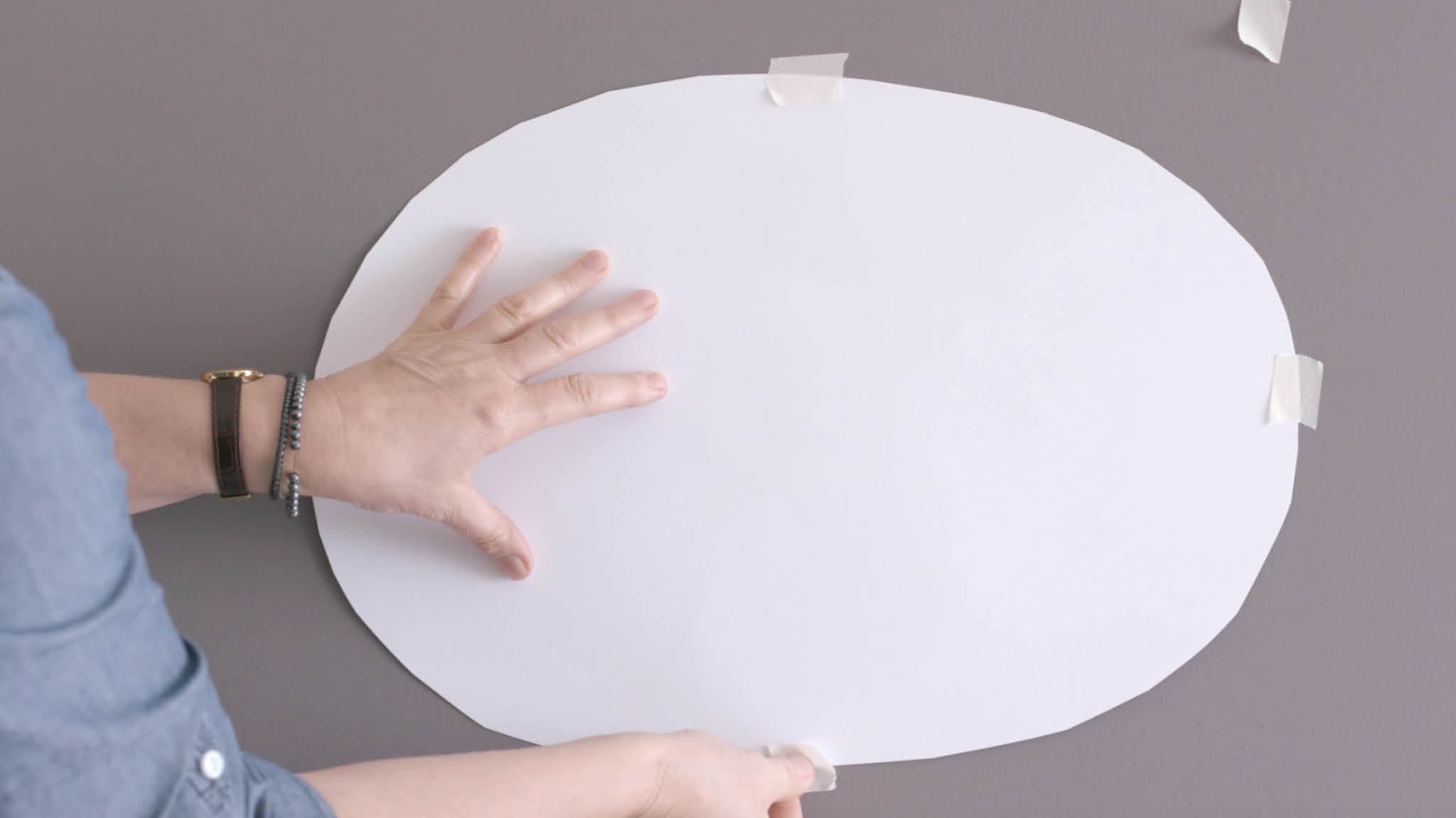 Oval taped to wall Tape your oval to the area you’d like to paint